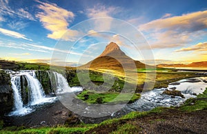 Sunset over Kirkjufellsfoss Waterfall and Kirkjufell mountain in