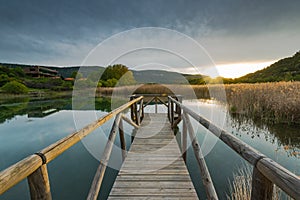 Sunset over lake and grass lands