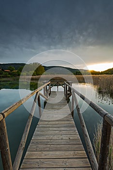 Sunset over lake and grass lands