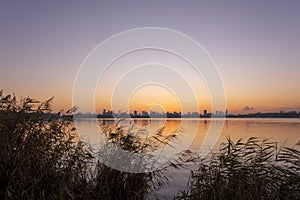 Sunset over lake Kralingse Plas in Rotterdam, the Netherlands, as seen from the promenade