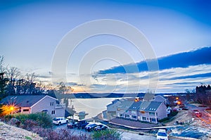 Sunset over lake and residential area at lake