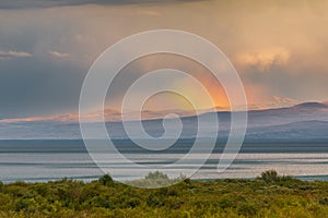 Sunset over Lake Sevan, mountain in the background. Armenia
