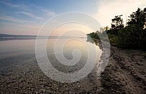 Sunset over lake shoreline