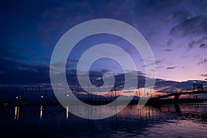 Sunset over the lake. Tranquil scene of Ouchy harbor, Lausanne, Switzerland