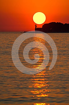 Sunset over lighthouse in Zadar