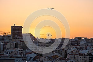 Sunset Over Lisbon City with Air Plane in Sky