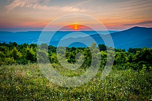 Sunset over a meadow at Pass Mountain Overlook, Skyline Drive, S