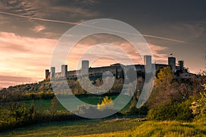 Sunset over the medieval fortified town of Monteriggioni, Tuscany,  Italy