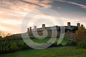 Sunset over the medieval fortified town of Monteriggioni, Tuscany,  Italy