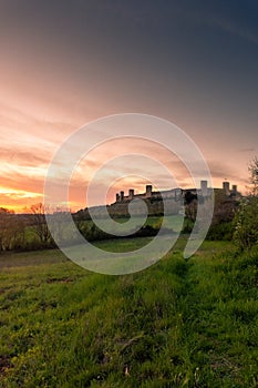 Sunset over the medieval fortified town of Monteriggioni, Tuscany,  Italy