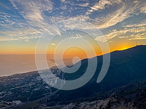Sunset over Mediterranean sea and Fuengirola from Calamorro peak photo