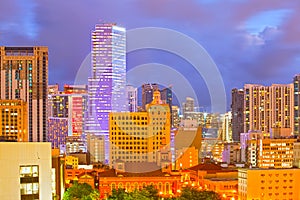 SUnset over Miami Florida skyline with illuminated modern buildings