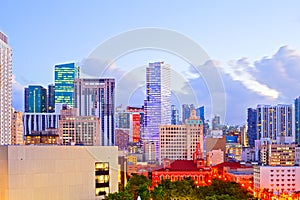 SUnset over Miami Florida skyline with illuminated modern buildings