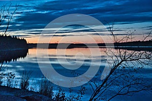 Sunset over  Mildred  lake north of Fort McMurray Alberta