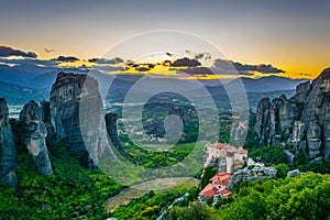 Sunset over monasteries of Roussanou and Saint Nicholas Anapavsa at Meteora, Greece