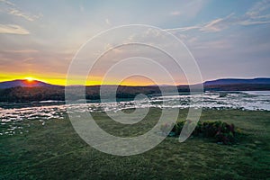 Sunset over Moody Tupper Lake NY Adirondacks in early fall aerial