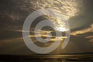 Sunset over Morecambe Bay the largest estuary in northwest England, just to the south of the Lake District National Park. It is