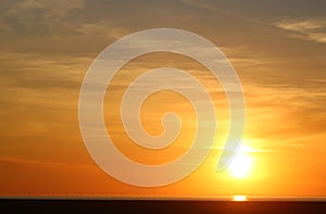 Sunset over Morecambe Bay, wind farm on horizon