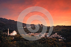 Sunset over mountain villages in Corsica photo