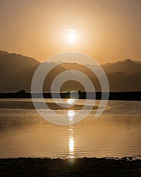 Sunset over mountains and lagoon in south Sinai, Dahab