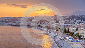 Sunset over Nice city and Mediterranean Sea aerial timelapse