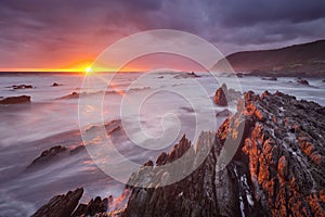 Sunset over the ocean in Garden Route NP, South Africa