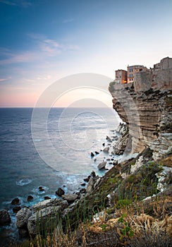 Sunset over the Old Town of Bonifacio, the limestone cliff