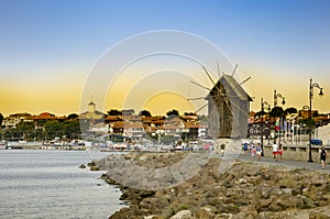 Sunset over old windmill in the ancient town of Nesebar, Bulgaria