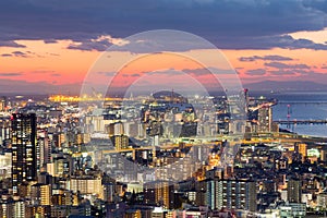 Sunset over Osaka city downtown aerial view