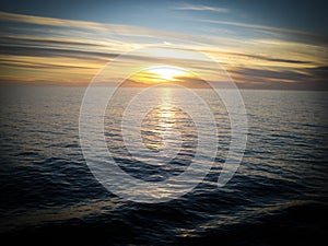 Sunset over the Pacific Ocean from a cruiseliner photo