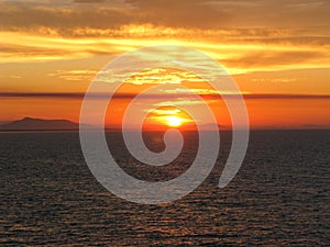 Sunset over the Pacific Ocean from a cruiseliner photo
