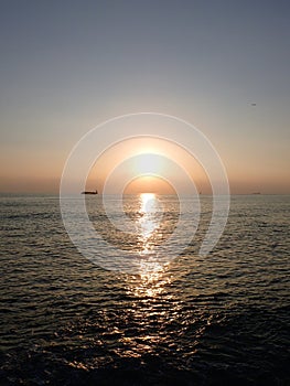Sunset over the Pacific Ocean with light reflecting on water and