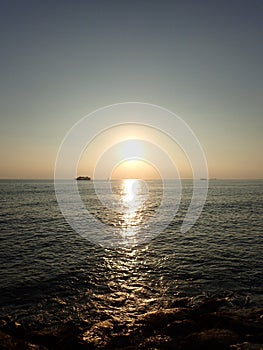 Sunset over the Pacific Ocean with light reflecting on water and