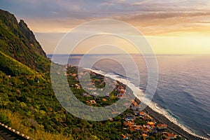 Sunset over Paul Do Mar coastal village in the Madeira Islands, Portugal