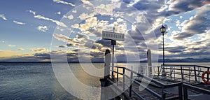 Sunset over pier at lake Garda in Bardolino Italy