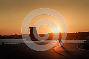 Sunset over a pier in Lisbon