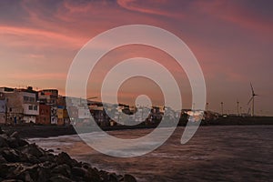 Pozo Izquierdo coastal town at sunset photo