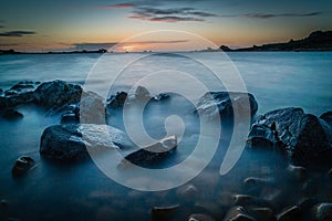 Sunset over Primel harbour in Bretagne in France, long exposure