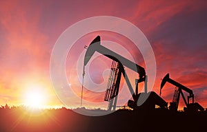 Sunset Over Pumpjack Silhouette With Copy Space