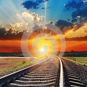 Sunset over railroad photo