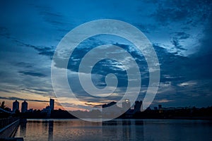 Sunset over the river in the city. Summer in the city.