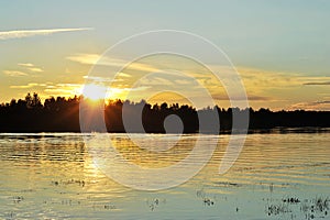 Sunset over the river and forest
