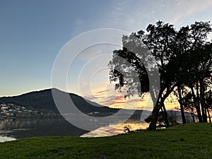 Sunset over the river Minho, mountain and the trees near Eiras, O Rosal, Galicia, Spain, January 2023