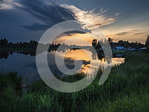 Sunset over the river. Pudost village. Russia