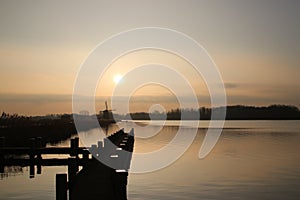 Sunset over the river rotte and waterstorage of the Eendragtspolder in Zevenhuizen, Netherlands