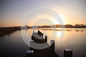 sunset over the river Rotte in Zevenhuizen near Rotterdam with r