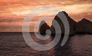 Sunset over a Rock Formation in Cabo San Lucas, Mexico