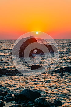 Sunset over rock formation in Sfinari beach, Crete,  Greece