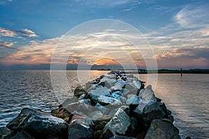 Sunset over a rock jetty on the Chesapeake Bay