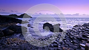 Sunset over rocks formation Giant`s Causeway, County Antrim, Northern Ireland